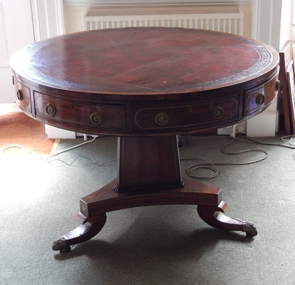 Appraisal: A George IV rosewood and brass inlaid drum top library