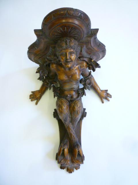 Appraisal: A CONTINENTAL LIMEWOOD FIGURAL WALL BRACKET late th century modelled