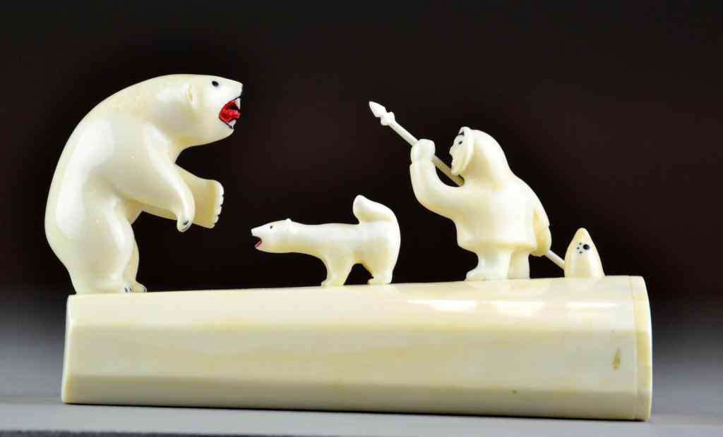 Appraisal: Inuit Ivory Carving of Figures with Polar BearDepicting several figures