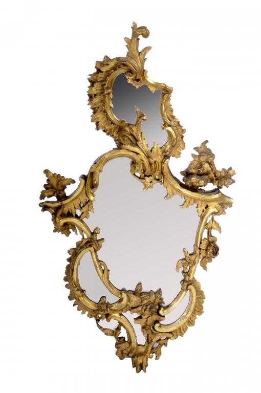 Appraisal: A VICTORIAN ROCOCO REVIVAL GILTWOOD MIRROR carved with leafy scrolls