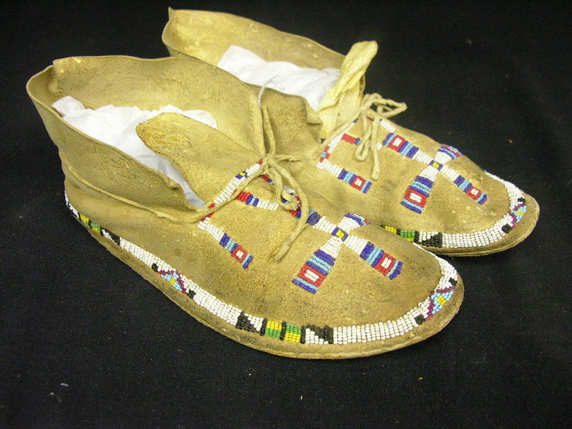 Appraisal: NATIVE AMERICAN BEADED MOCCASINS Hand sewn brain tanned leather nice