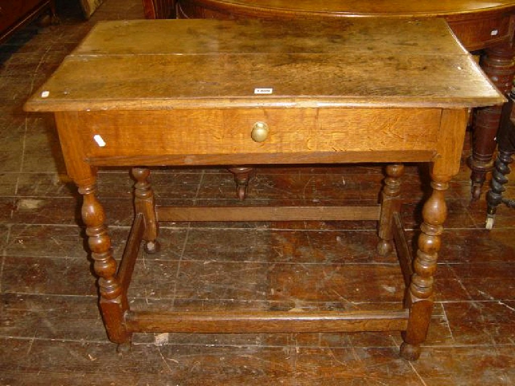 Appraisal: A Georgian oak side table fitted with single frieze drawer