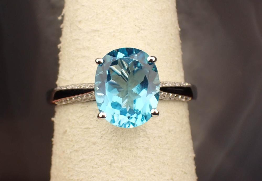 Appraisal: BLUE TOPAZ DIAMOND AND FOURTEEN KARAT GOLD RING The white