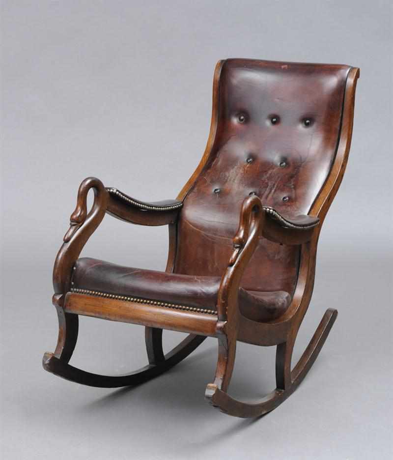 Appraisal: GEORGE IV CARVED MAHOGANY ROCKING ARMCHAIR The spoon-shape button leather