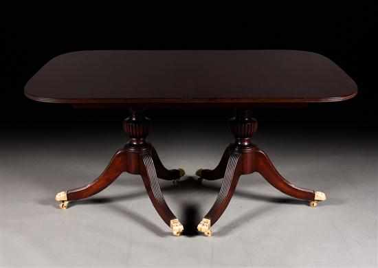 Appraisal: Federal style carved mahogany double pedestal dining table Potthast Brothers