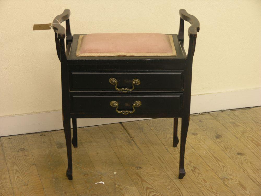 Appraisal: A late Victorian dark stained piano stool with upholstered seat