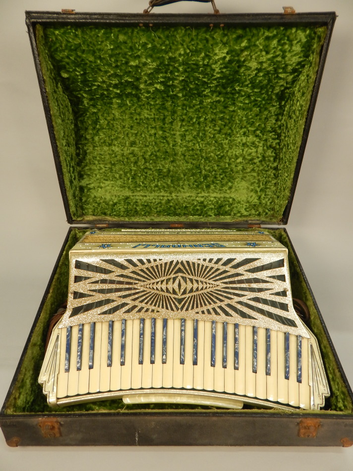 Appraisal: A Scandalli Scott Wood Three piano accordion in simulated marble