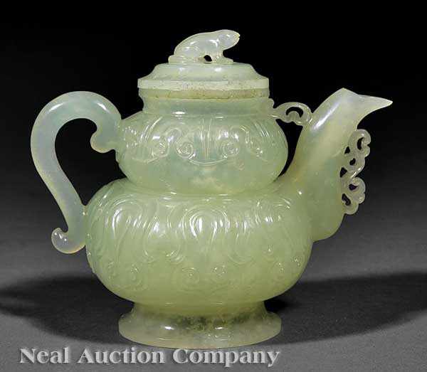 Appraisal: A Chinese Carved Celadon Jade Covered Teapot the relief-carved double-bulbed