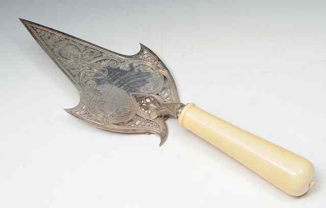 Appraisal: A SILVER AND IVORY HANDLE PRESENTATION TROWEL with pierced and