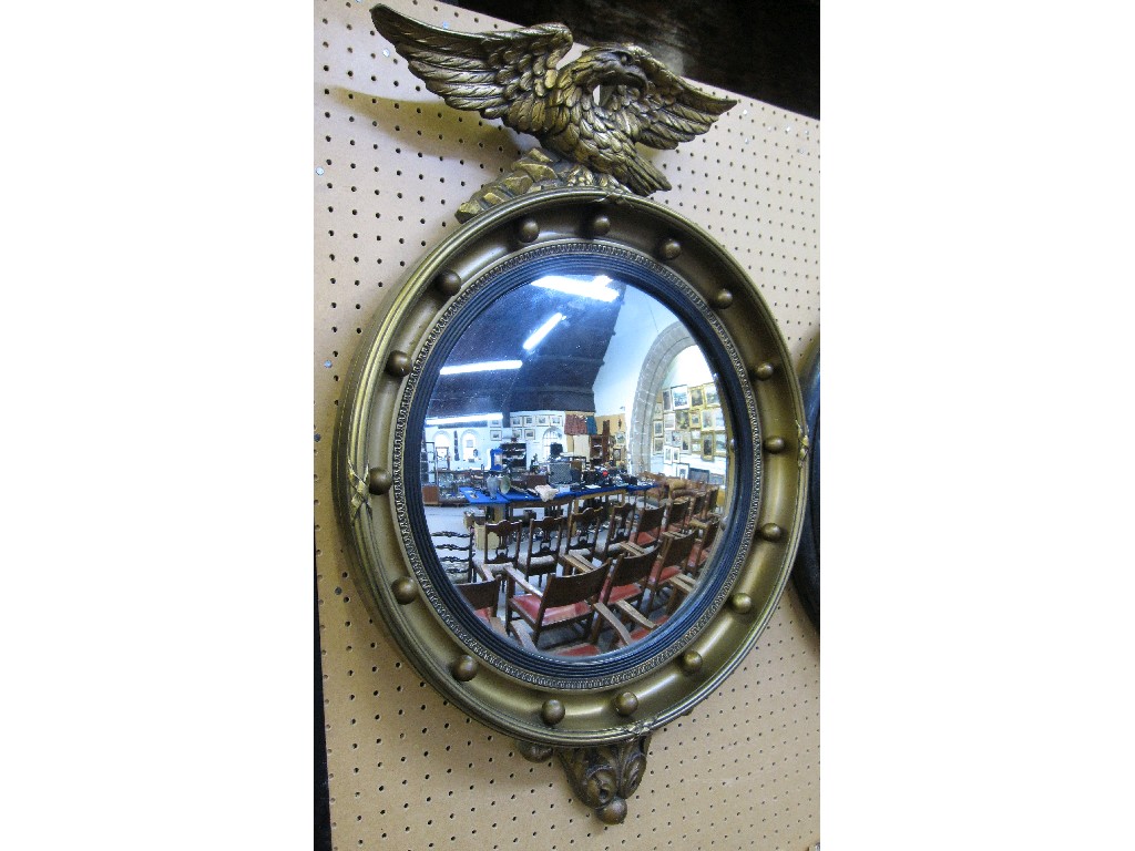 Appraisal: Gilt gesso framed convex mirror with eagle pediment