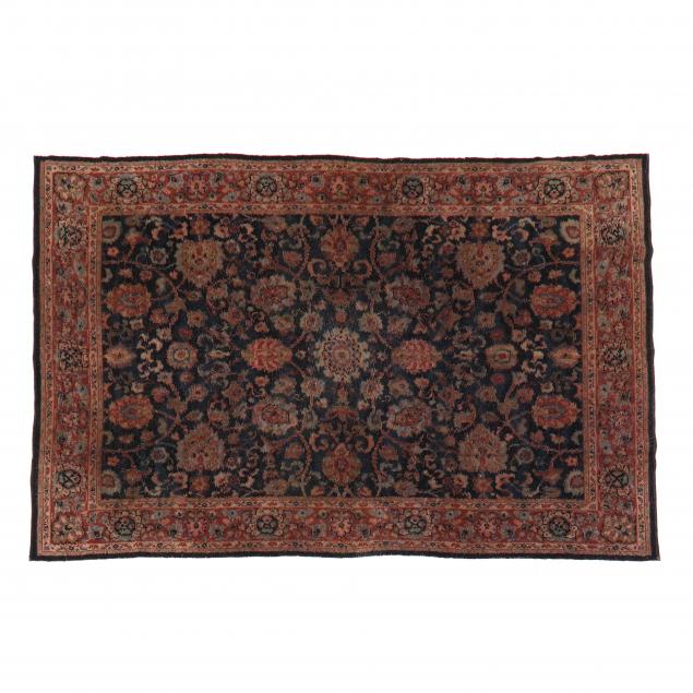 Appraisal: WOOL RUG Dark blue field with allover floral design elements