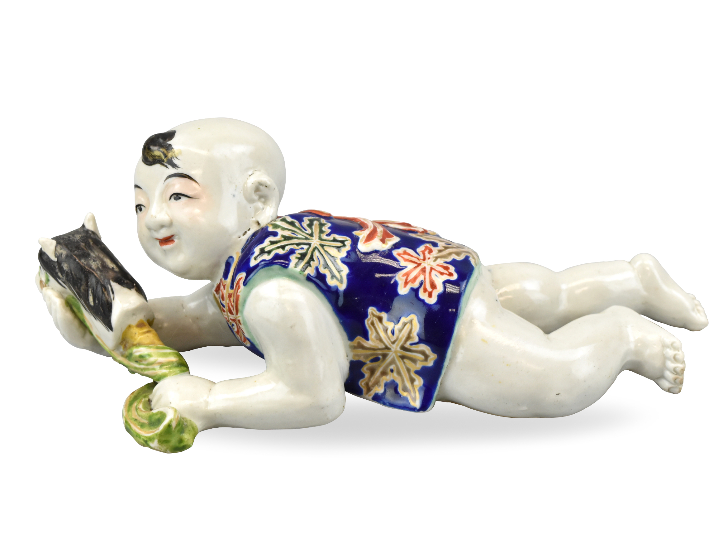 Appraisal: A Japanese porcelain figure of a crawling boy holding a