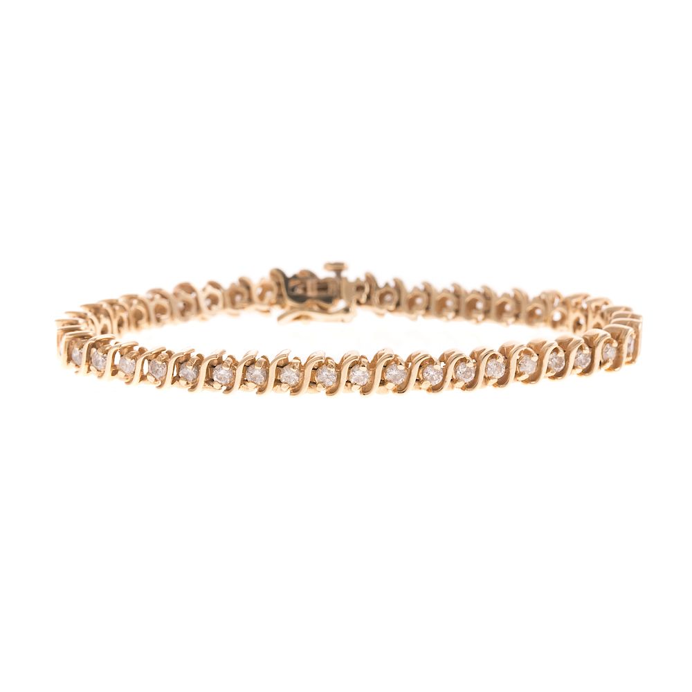 Appraisal: A Duneier Gold and Diamond Tennis Bracelet in K K