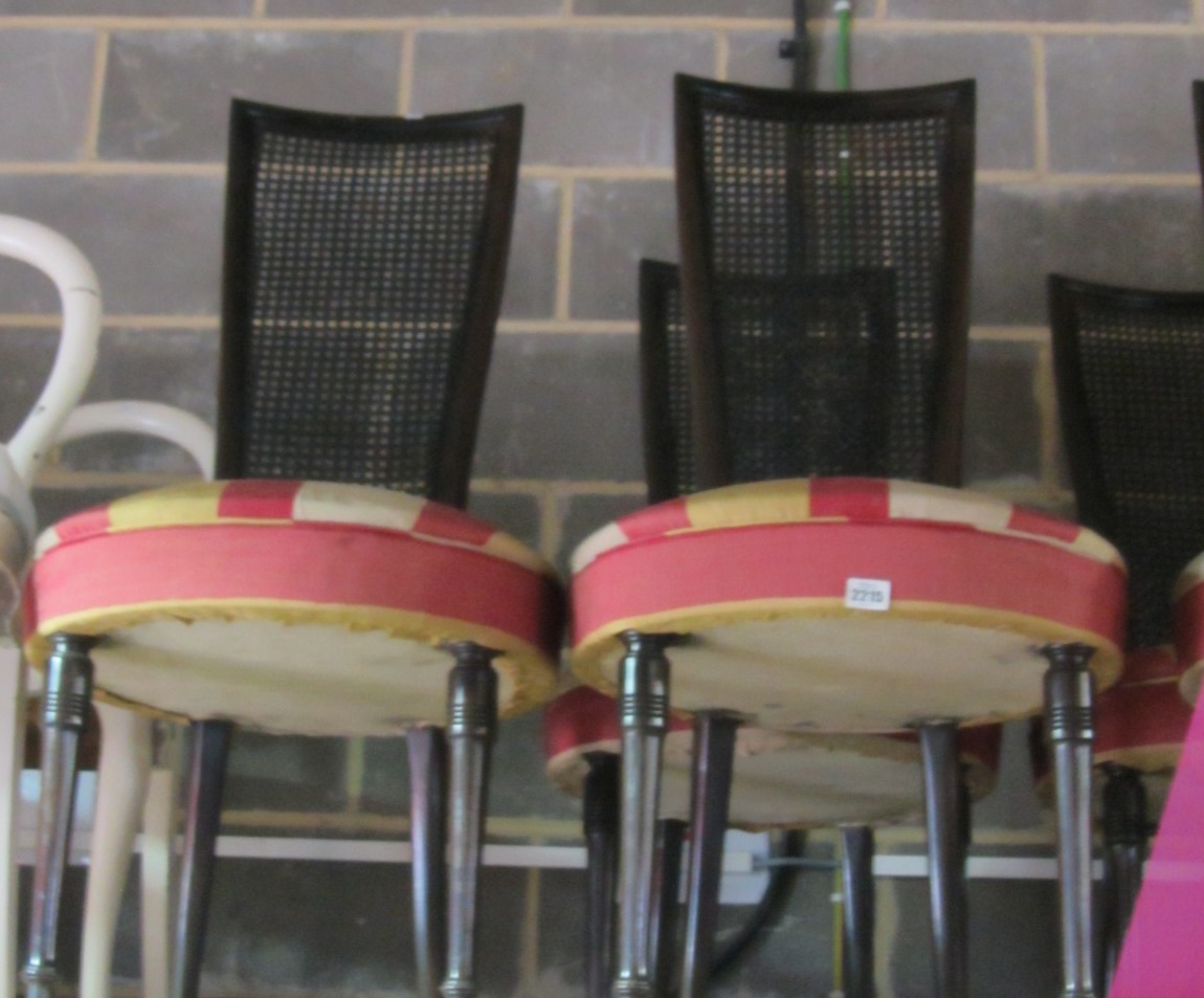 Appraisal: A set of nine ebonised dining chairs with cane back