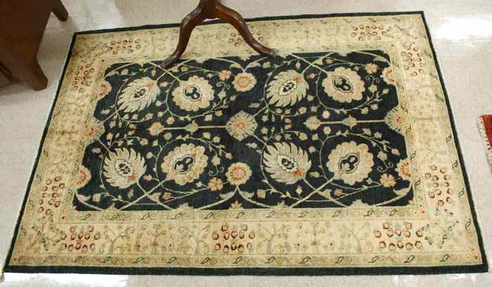 Appraisal: HAND KNOTTED ORIENTAL AREA RUG Pakistani-Persian palmette and scrolling vine