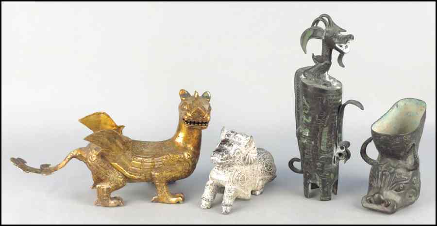 Appraisal: THREE PATINATED METAL MYTHICAL ANIMAL FORMS Together with a carved