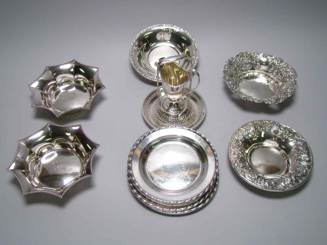 Appraisal: TWELVE PIECES OF STERLING SILVER HOLLOWWARE Five bread plates by