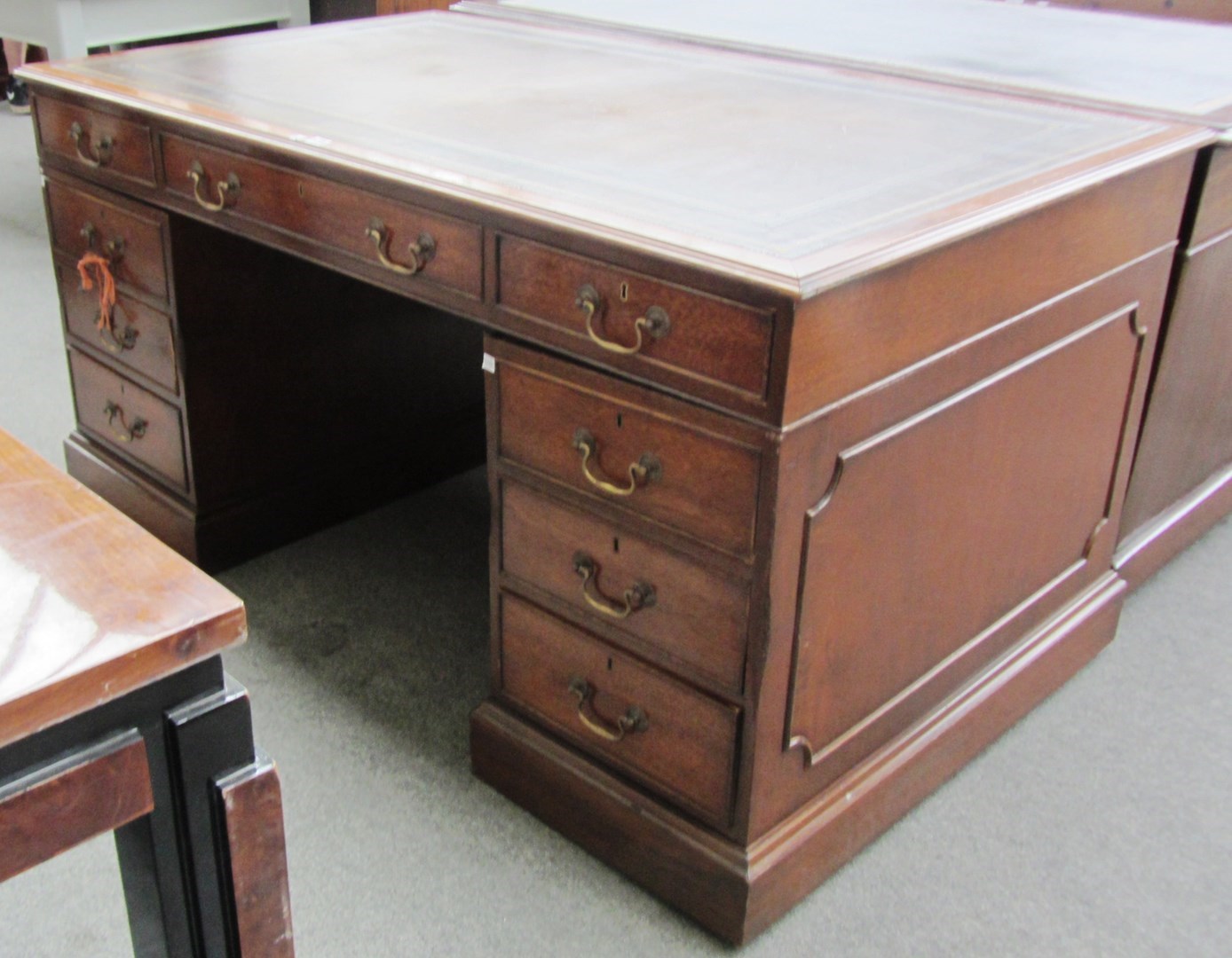 Appraisal: An th century style mahogany partners desk with nine drawers