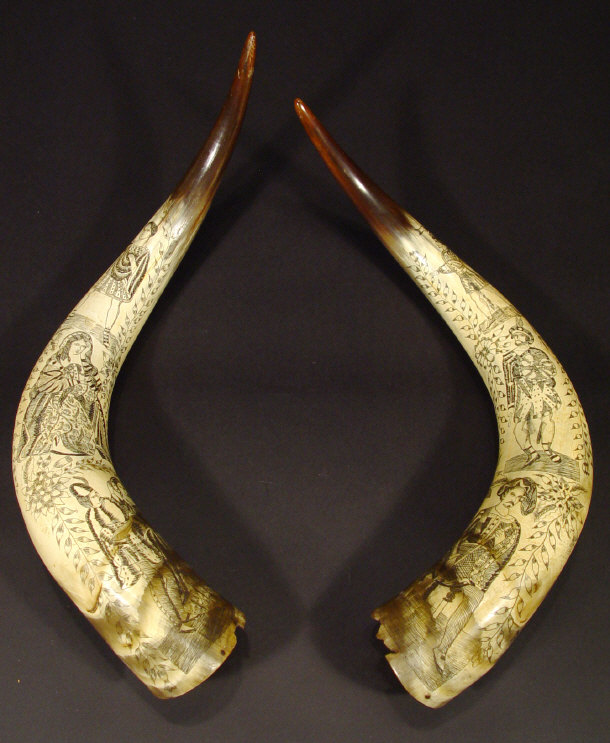 Appraisal: Two cattle horns engraved and stained with black ink with