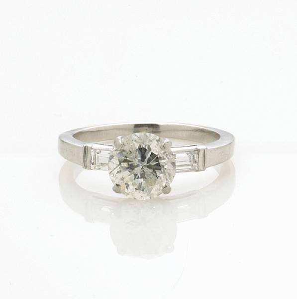 Appraisal: A diamond solitaire ring centering a transitional round brilliant-cut diamond