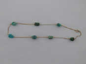 Appraisal: A yellow metal tests carat gold turquoise necklace stones approx