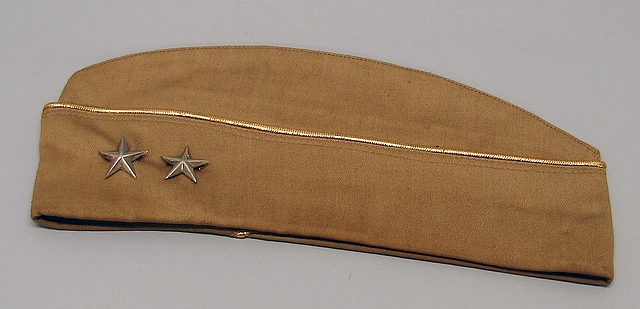 Appraisal: Cap with gold piping featuring Airborne patch and rank insignia