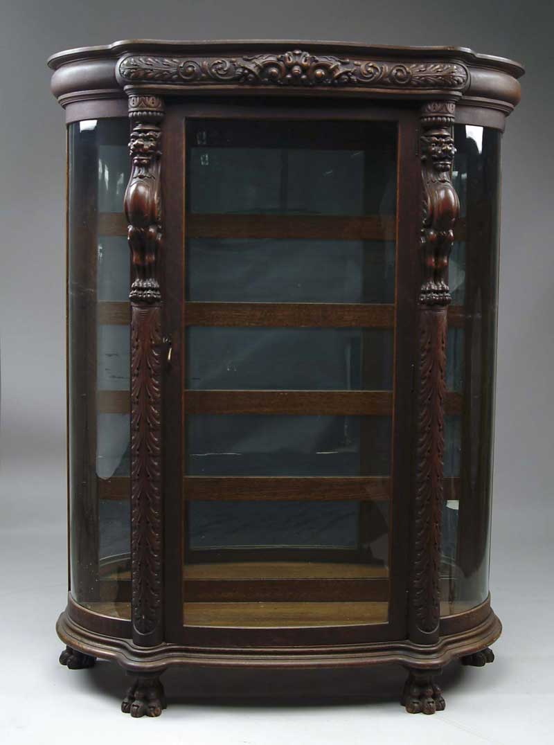 Appraisal: OUTSTANDING OAK CARVED CHINA CLOSET Bow front glass door with