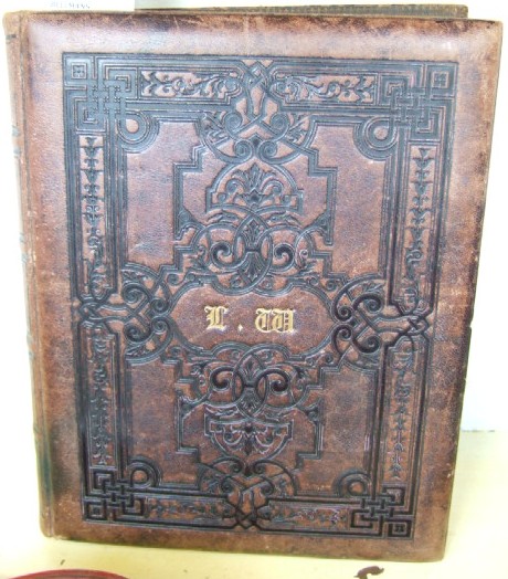 Appraisal: A Victorian leather bound photograph album the front embossed with