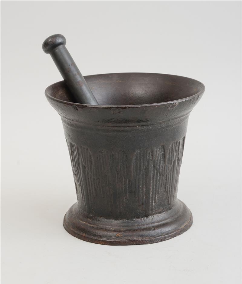 Appraisal: ITALIAN BAROQUE IRON MORTAR AND PESTLE The tapered bowl with