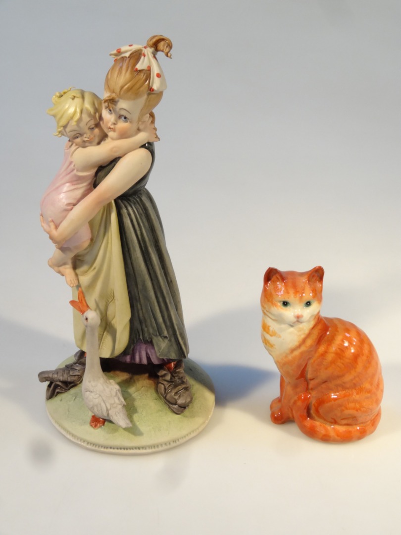 Appraisal: A Beswick figure of a seated kitten in brown and