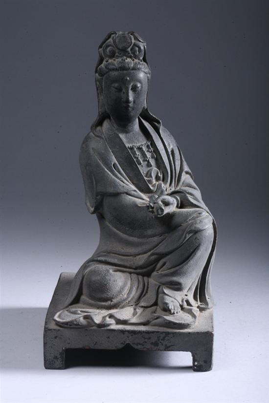 Appraisal: CHINESE BRONZE FIGURE OF GUANYIN Seated at ease wearing long