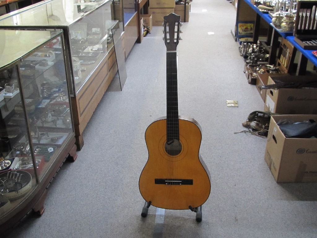 Appraisal: A six string acoustic guitar made in China