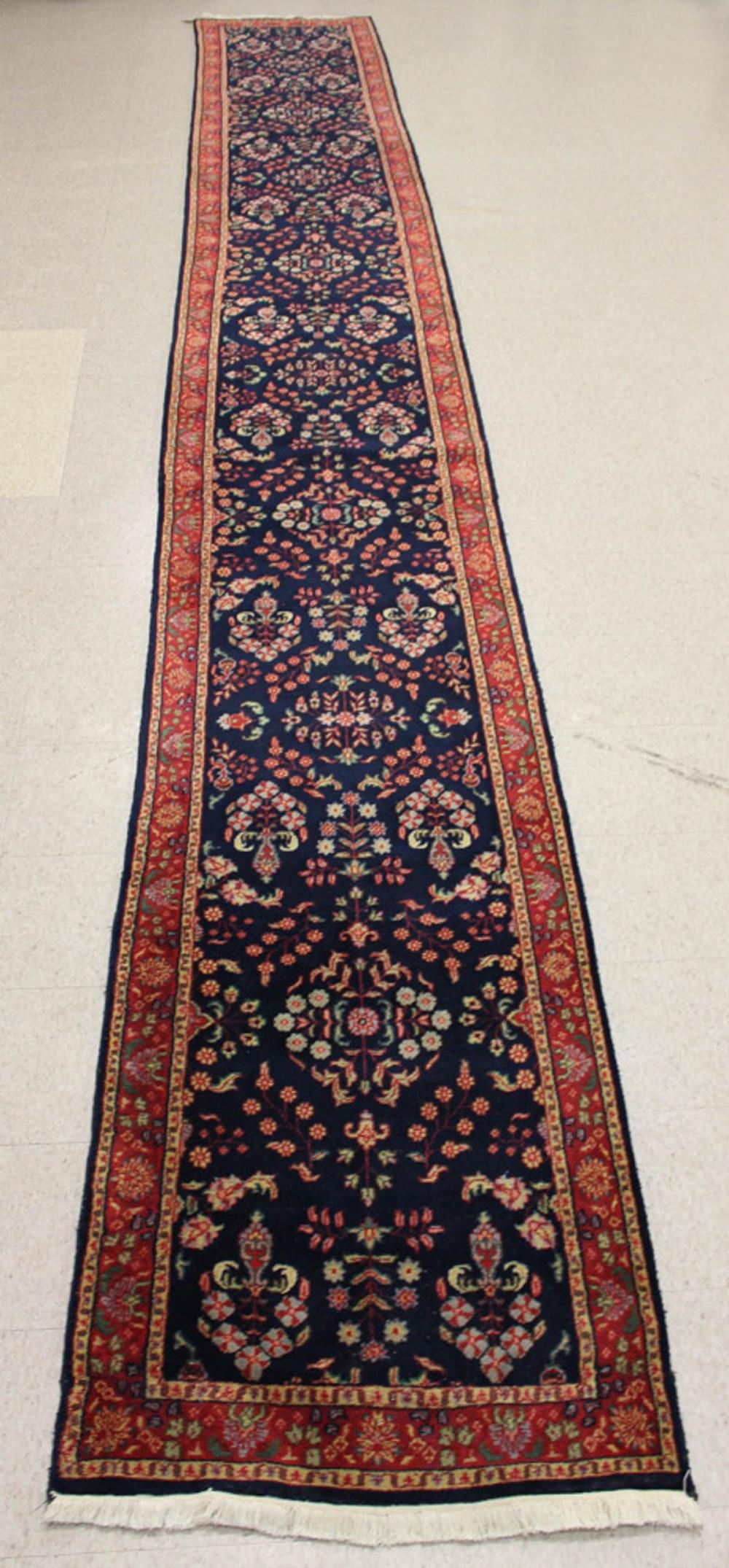 Appraisal: HAND KNOTTED ORIENTAL LONG RUG Indo-Persian Sarouk floral design on