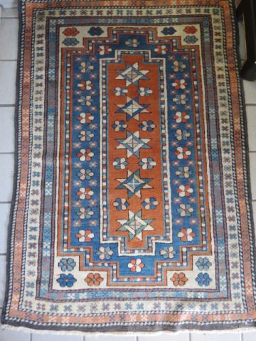 Appraisal: Kazak Persian Handmade Rug star and floral style multi border