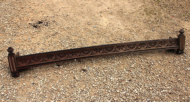 Appraisal: A VICTORIAN MAHOGANY CONCAVE CARVED PELMET with stylised flower head