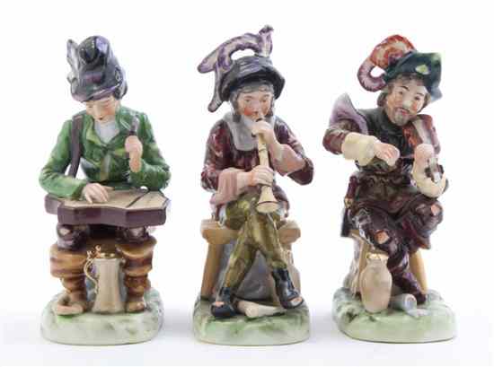 Appraisal: Three Continental Porcelain Figures each depicting a seated musician having