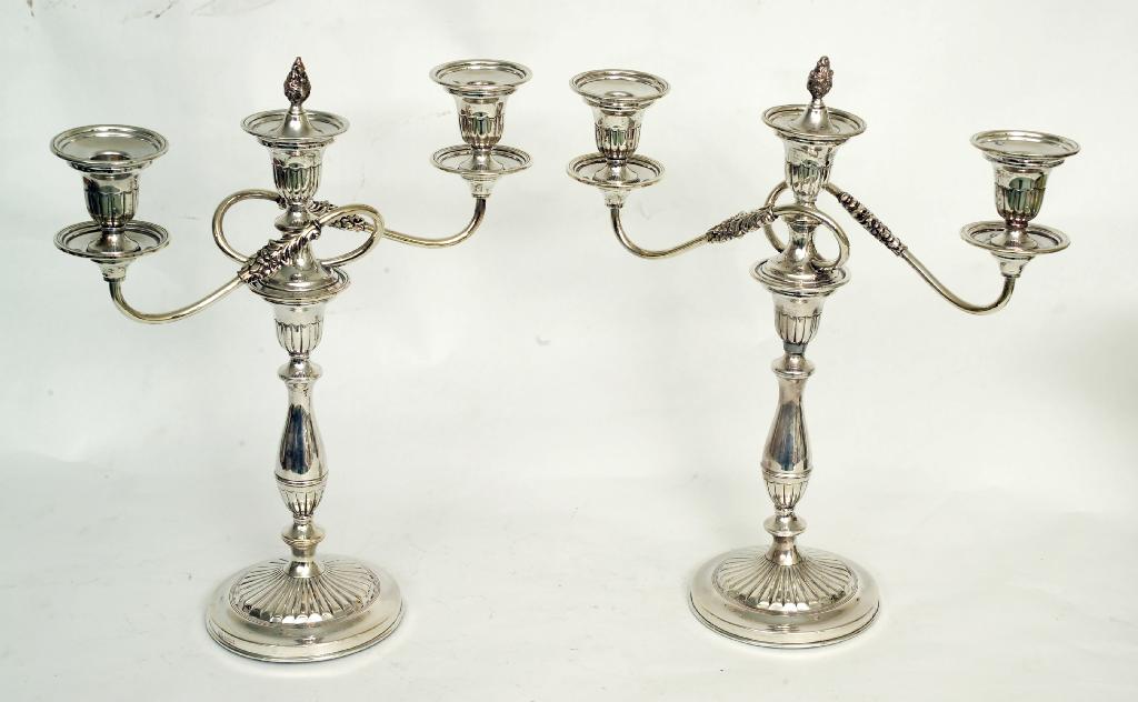 Appraisal: PAIR OF REGENCY STYLE SILVER-PLATED THREE-LIGHT CANDELABRA each with campana