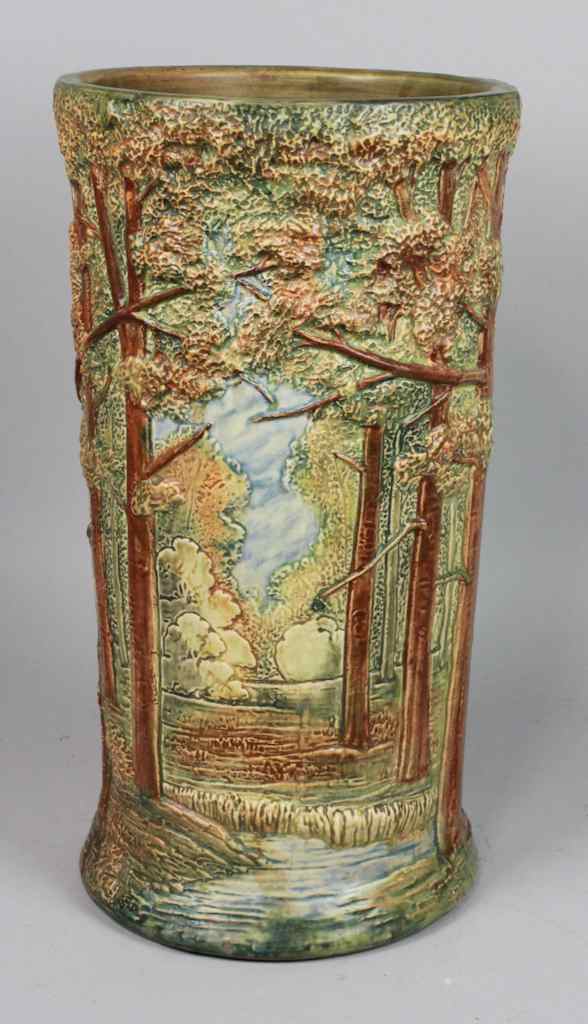 Appraisal: WELLER POTTERY FOREST PATTERN UMBRELLA STAND Typically decorated with a