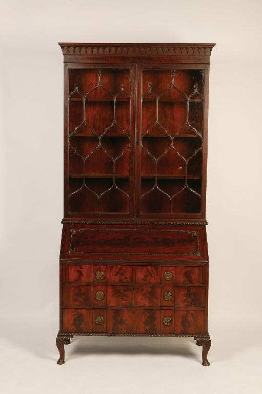 Appraisal: A GEORGE III STYLE MAHOGANY BOOKCASE the upper section with