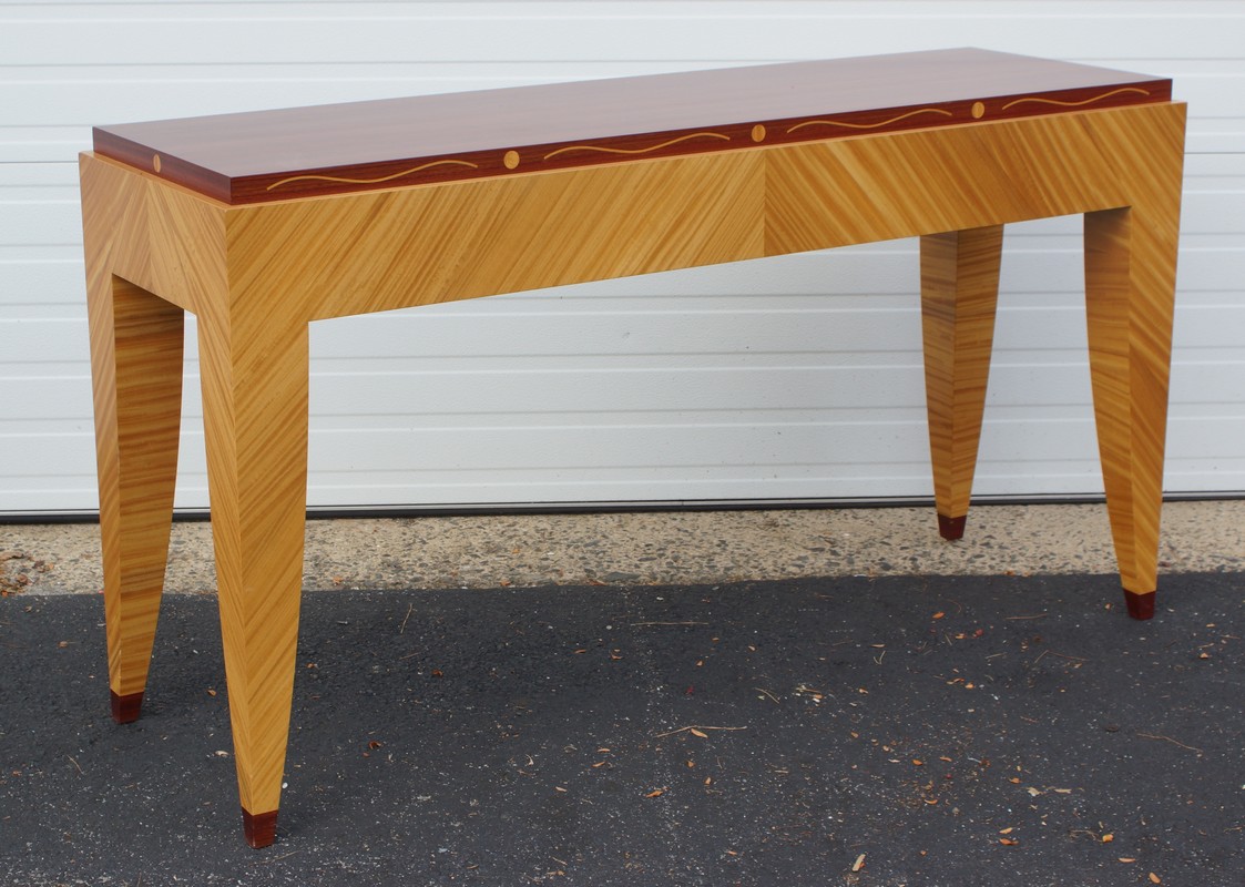 Appraisal: Alan Lorn Mid-century design satinwood and mahogany console table serpentine