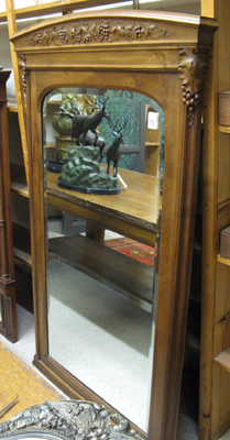 Appraisal: CARVED WALNUT PIER MIRROR French early th century having a