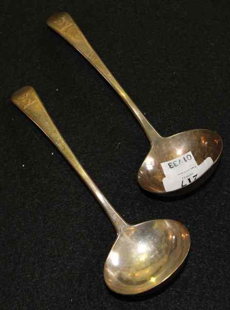 Appraisal: A PAIR OF OLD ENGLISH PATTERN SILVER LADLES monogrammed London