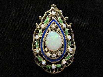 Appraisal: Opalescent and gold tear drop pendantOval opal framed by four