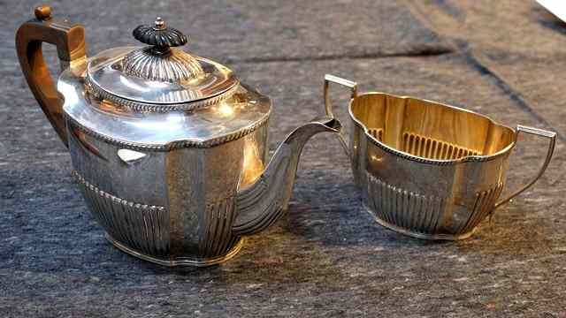 Appraisal: A LATE VICTORIAN OVAL TEAPOT with fluted sides and lower