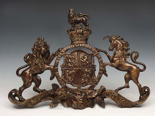 Appraisal: A BRONZE ROYAL COACH MOUNT in the form of a