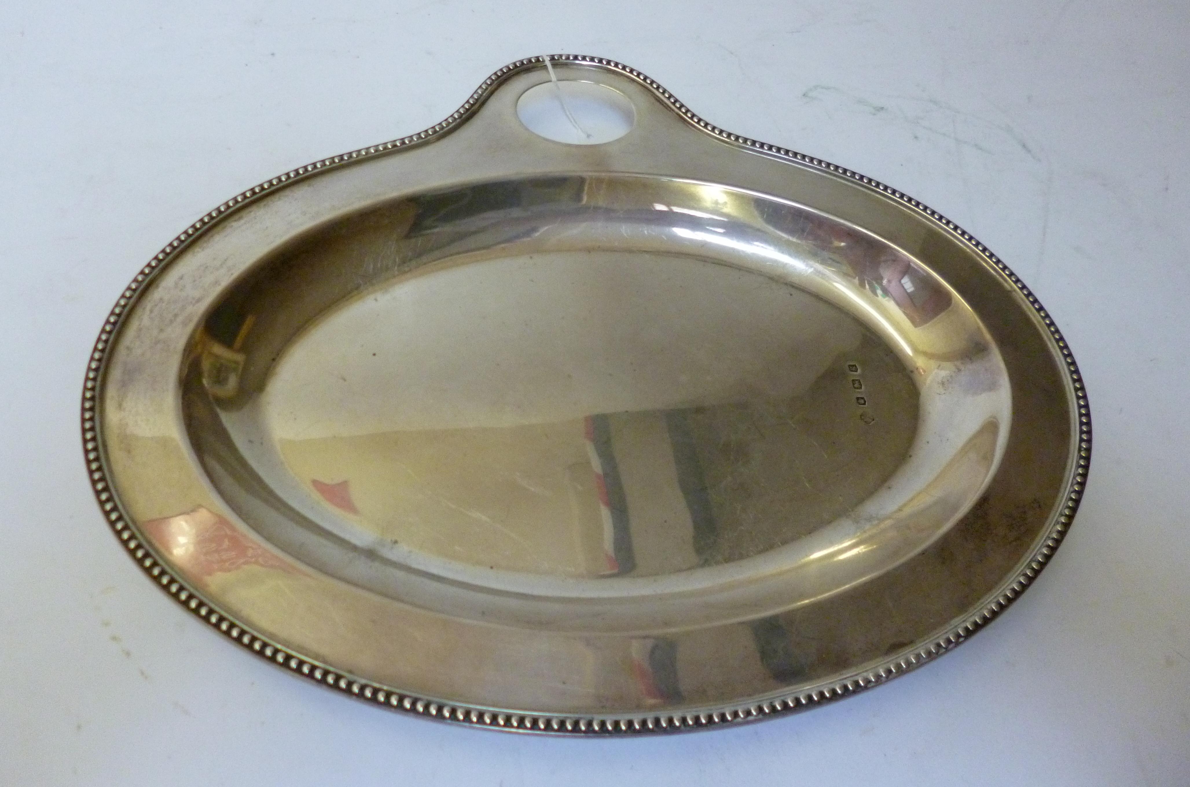 Appraisal: AN EDWARDIAN DISH maker Hutton Sons Birmingham of oval form