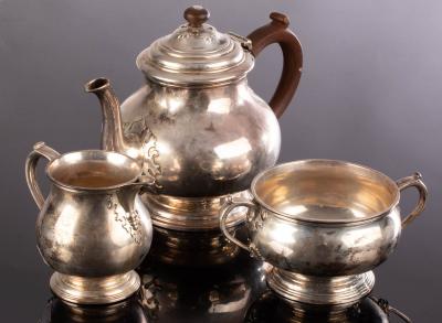 Appraisal: A three-piece silver tea service Charles Richard Comyns London with