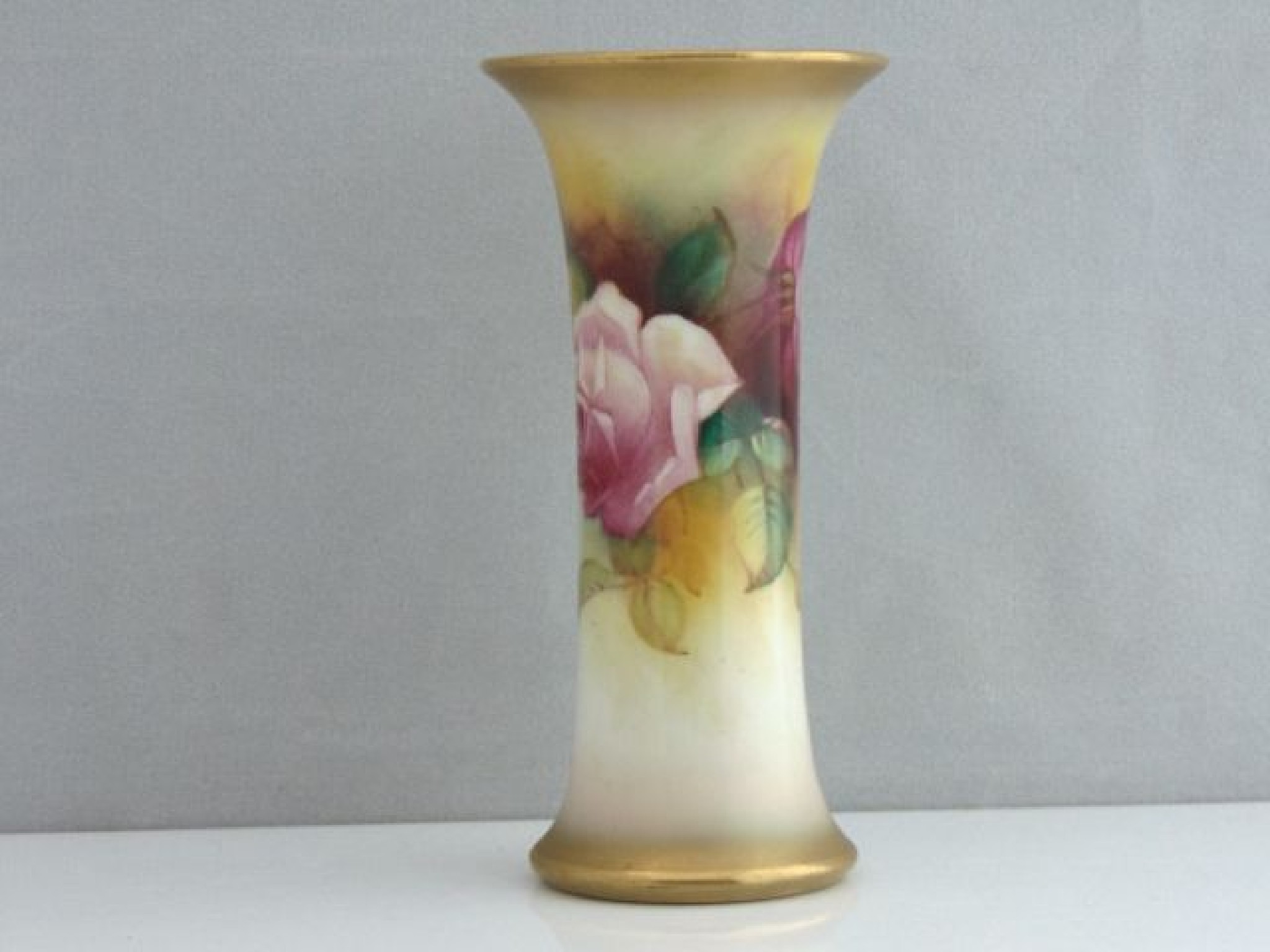 Appraisal: A Royal Worcester vase of waisted form with painted pink