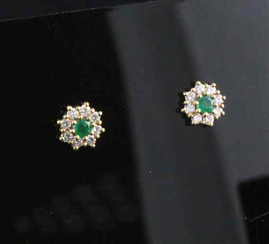 Appraisal: A pair of ct gold emerald and diamond cluster ear