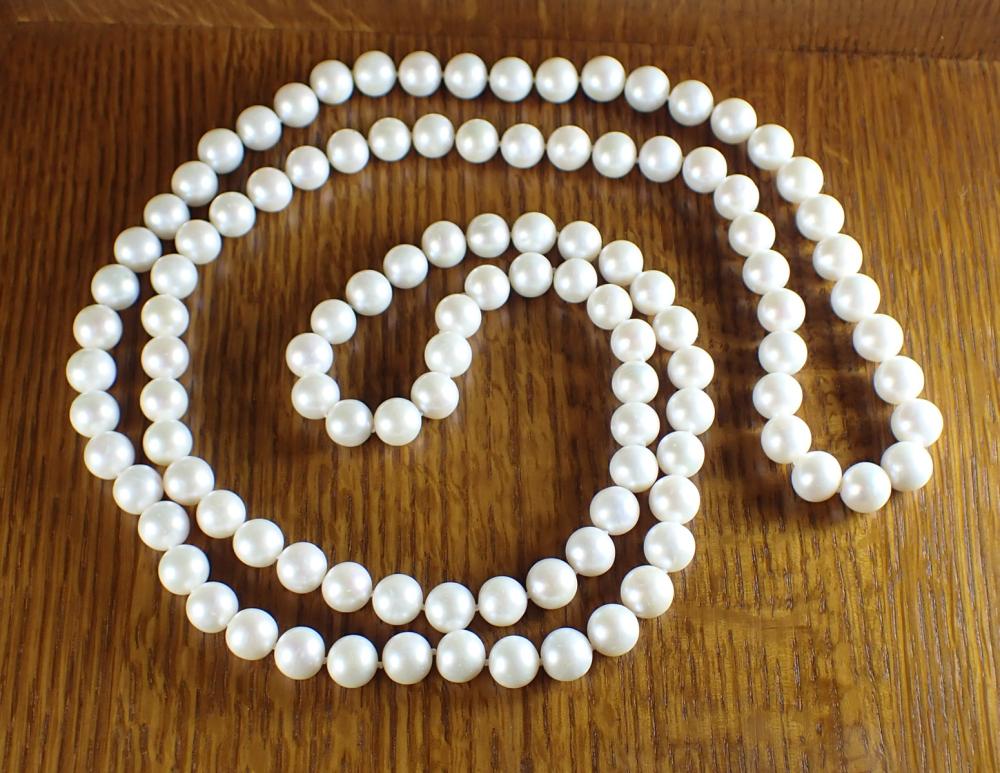 Appraisal: ROPE LENGTH WHITE PEARL NECKLACE hand-knotted strand of well matched